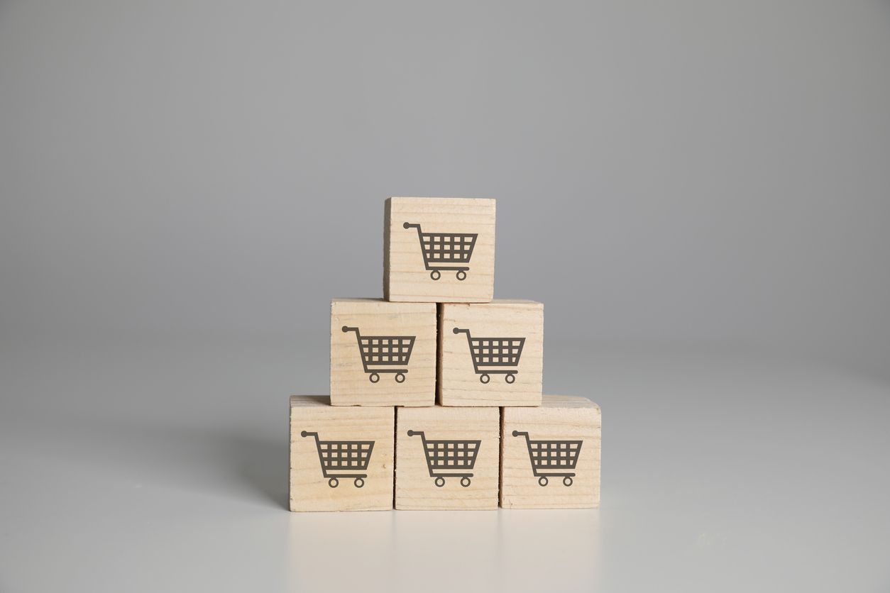 Conceptual image of building blocks with shopping carts