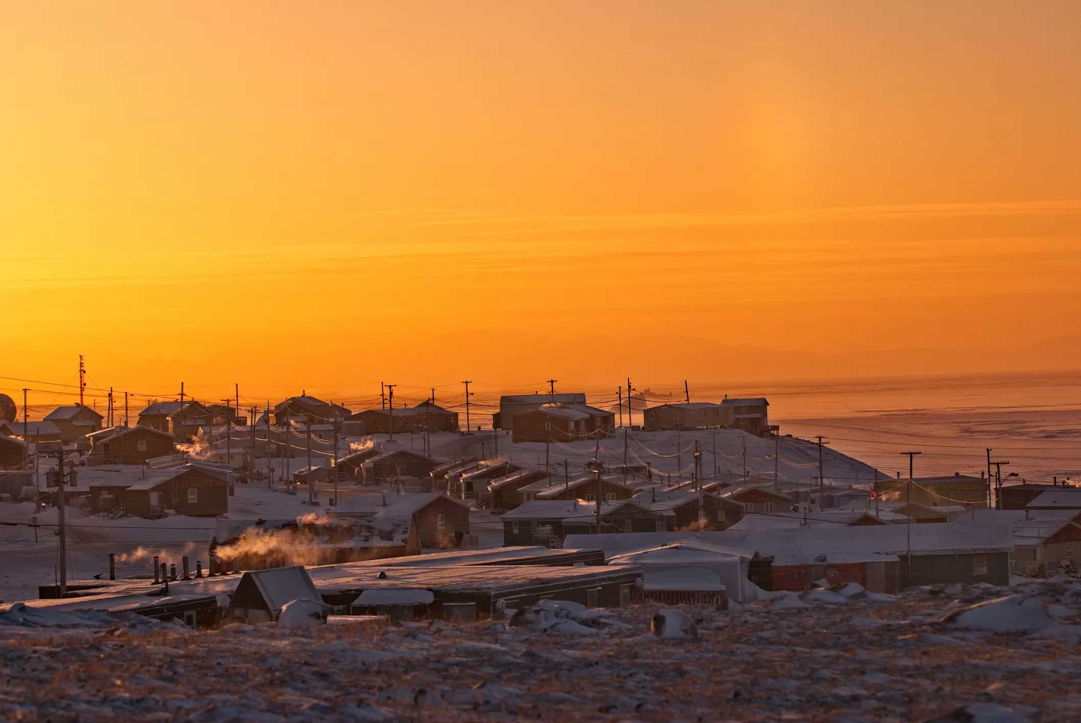 Wide-shot of a sunset over a Baffin Island community in Nunavut, Canada.