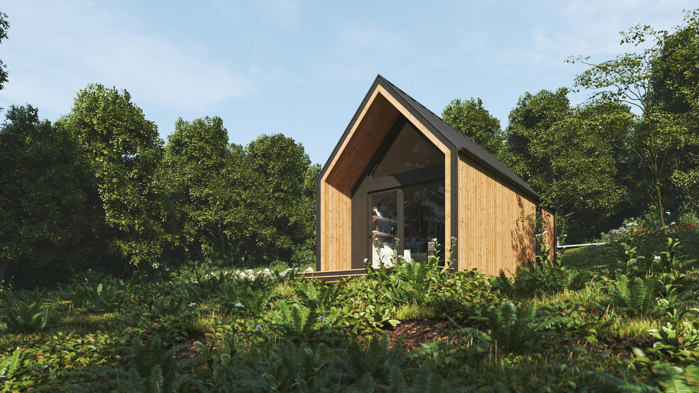 Exterior of a modern tiny house in a forest